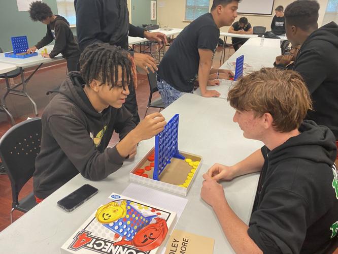 Kids playing Connect Four