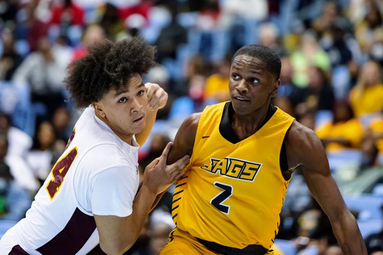 Image gallery from the 2021-22 NCHSAA Class 3A State Championship game between the Jay M. Robinson Bulldogs and the Farmville Central Jaguars at UNC Chapel HillÕs Dean E. Smith Center.  The Bulldogs defeated the Jaguars 70-68 to win the championship.