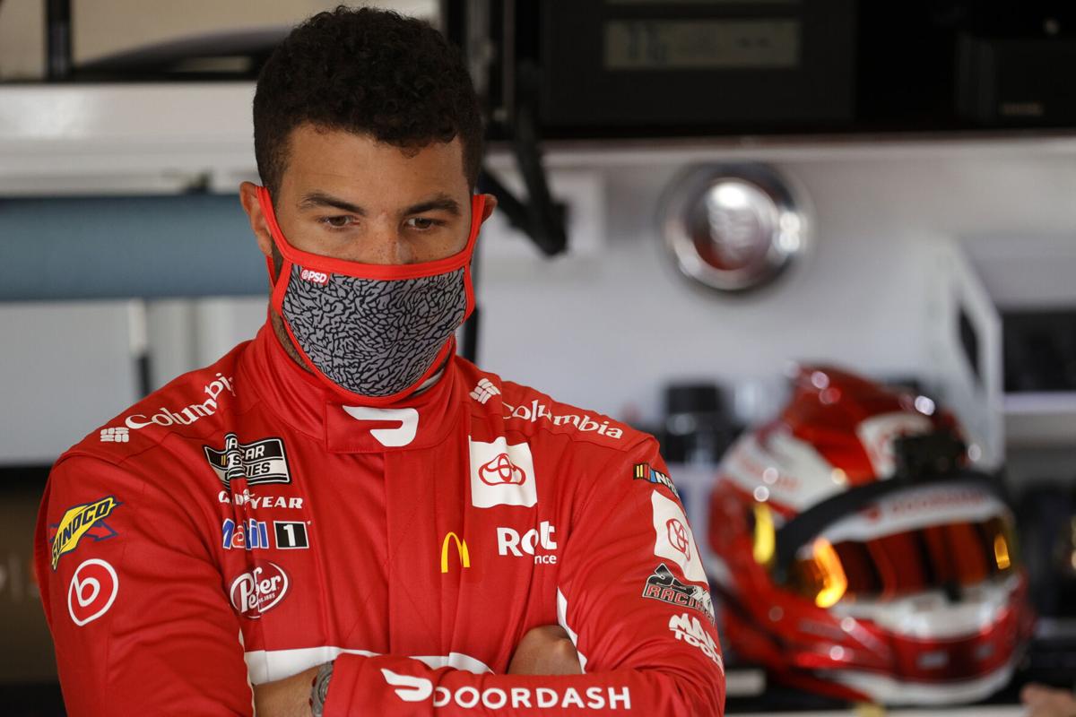 Bubba Wallace, the driver of the #23 DoorDash Toyota, waits in the garage area during practice for the NASCAR Cup Series 63rd Annual Daytona 500 at Daytona International Speedway on February 10, 2021, in Daytona Beach, Florida.