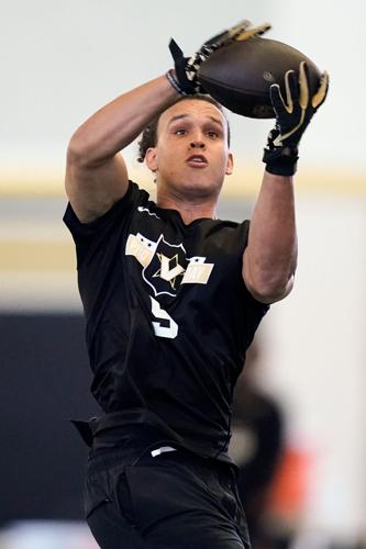 Vanderbilt tight end Eli Stowers receives a pass during football pro day at Vanderbilt University in Nashville, Tenn., Friday,