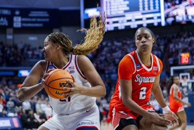 Sarah Strong of the Connecticut Huskies gets the rebound against Journey Thompson of the Syracuse Orange during the first half in the second round of the 2026 NCAA Women's Basketball Tournament at Harry A. Gampel Pavilion on Monday, March 23, 2026, in S...