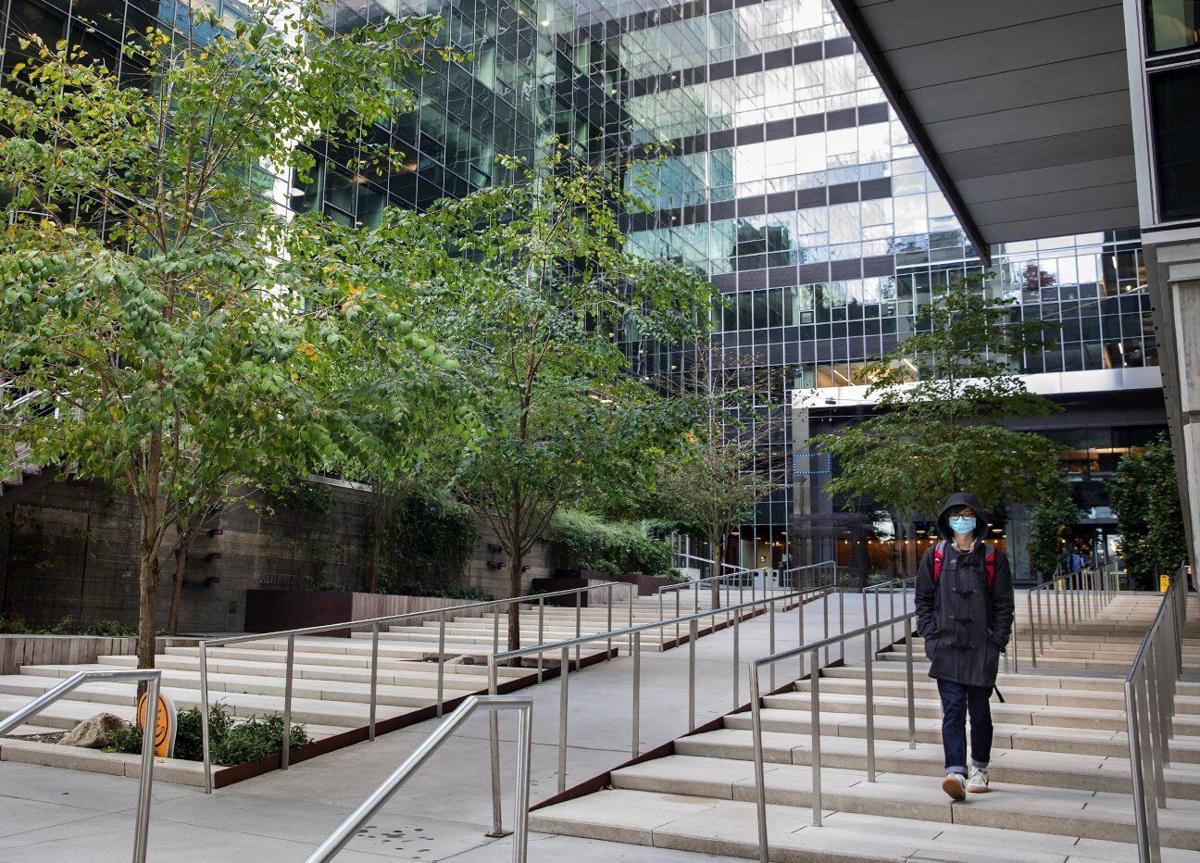 A lone person leaves an Amazon building in South Lake Union Wednesday, October 21, 2020.