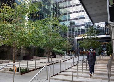 A lone person leaves an Amazon building in South Lake Union Wednesday, October 21, 2020.