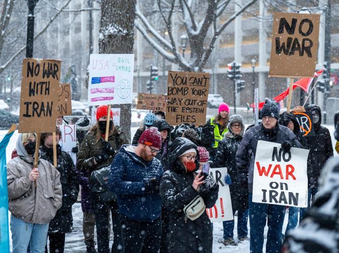 Protesters with the Milwaukee Anti-War Committee and allied local and national organizations rally at Zeidler Union Square on