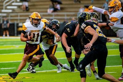 Cherokee’s Kingston Welch (21) carries the ball against Tuscola during their game Aug. 29, 2026, at C.E. Weatherby Stadium in Waynesville.