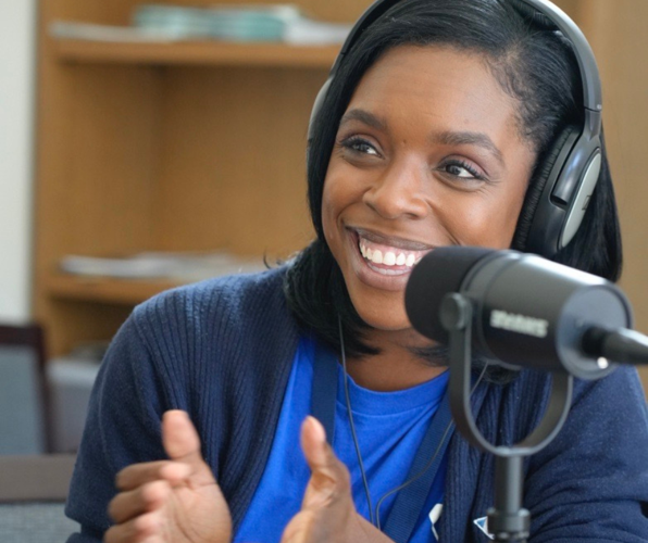 Dominique Clark recording a podcast episode