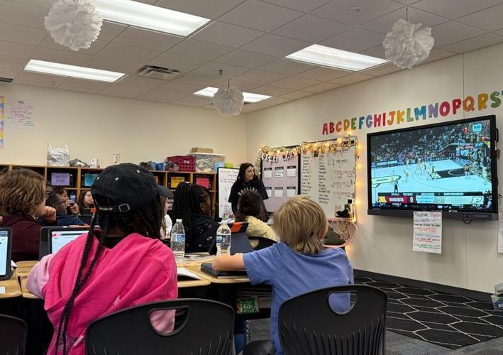 Fourth grade students at Glen Acres Elementary watch Purdue basketball highlights. The class, taught by Mya Lorenz, is using Purdue statistics in its curriculum.