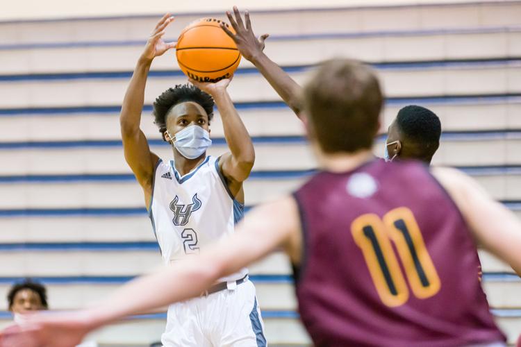 Boys Basketball: The Boys Jay M. Robinson Bulldogs defeated the Hickory Ridge RaginÕ Bulls 72-69 on Thursday night.