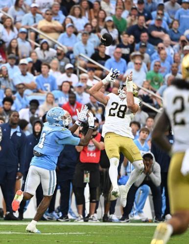 Oct 3, 2026; Chapel Hill, North Carolina, USA; Notre Dame Fighting Irish safety Luke Talich (28) intercepts a pass intended for North Carolina Tar Heels wide receiver Jordan Shipp (1) in the first quarter at Kenan Stadium. Mandatory Credit: Bob Donnan-I...