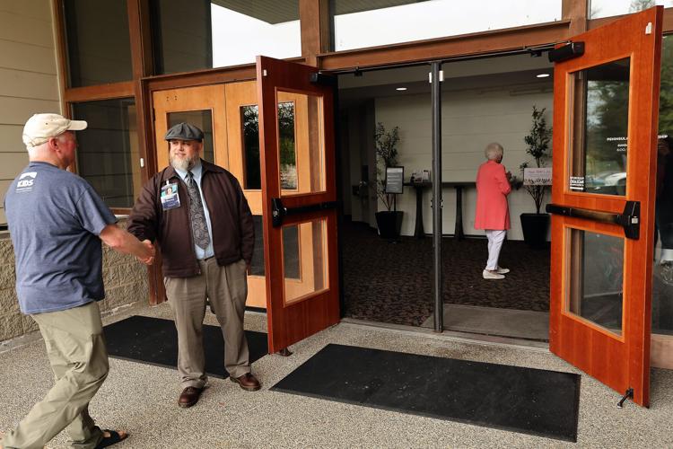 Abraham Warnock greets people coming to church at Peninsula Bible Fellowship on Sunday, May 10, 2026.