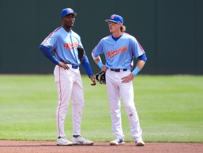 Knoxville Smokies infielders Ed Howard (9) and Karson Simas (1) talk during a pause in the Minor League against the Birmingham Barons on April 5, 2026, in Knoxville, Tennessee.