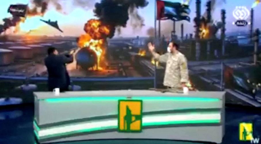 Iranian State News presenter fires gun at UAE flag during live broadcast