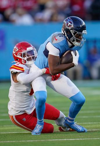 Tennessee Titans wide receiver Van Jefferson (11) is stopped by Kansas City Chiefs cornerback Kristian Fulton (8) during the