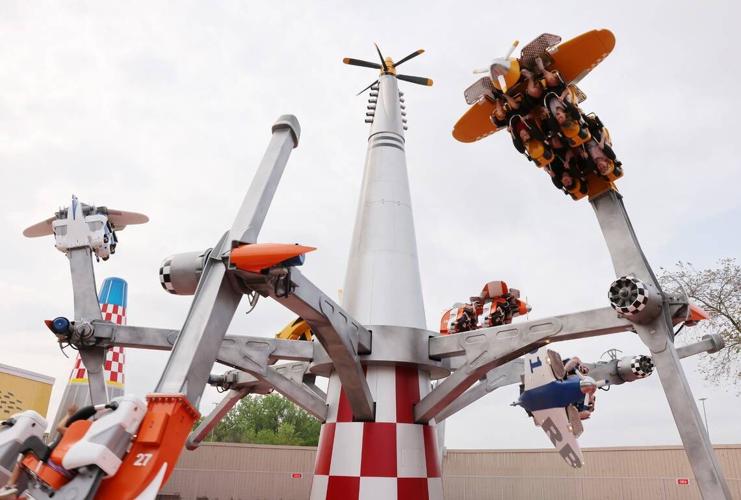 Riders scream as they fly upside down Thursday on the Air Racers attraction at Carowinds new Aeronautica Landing.