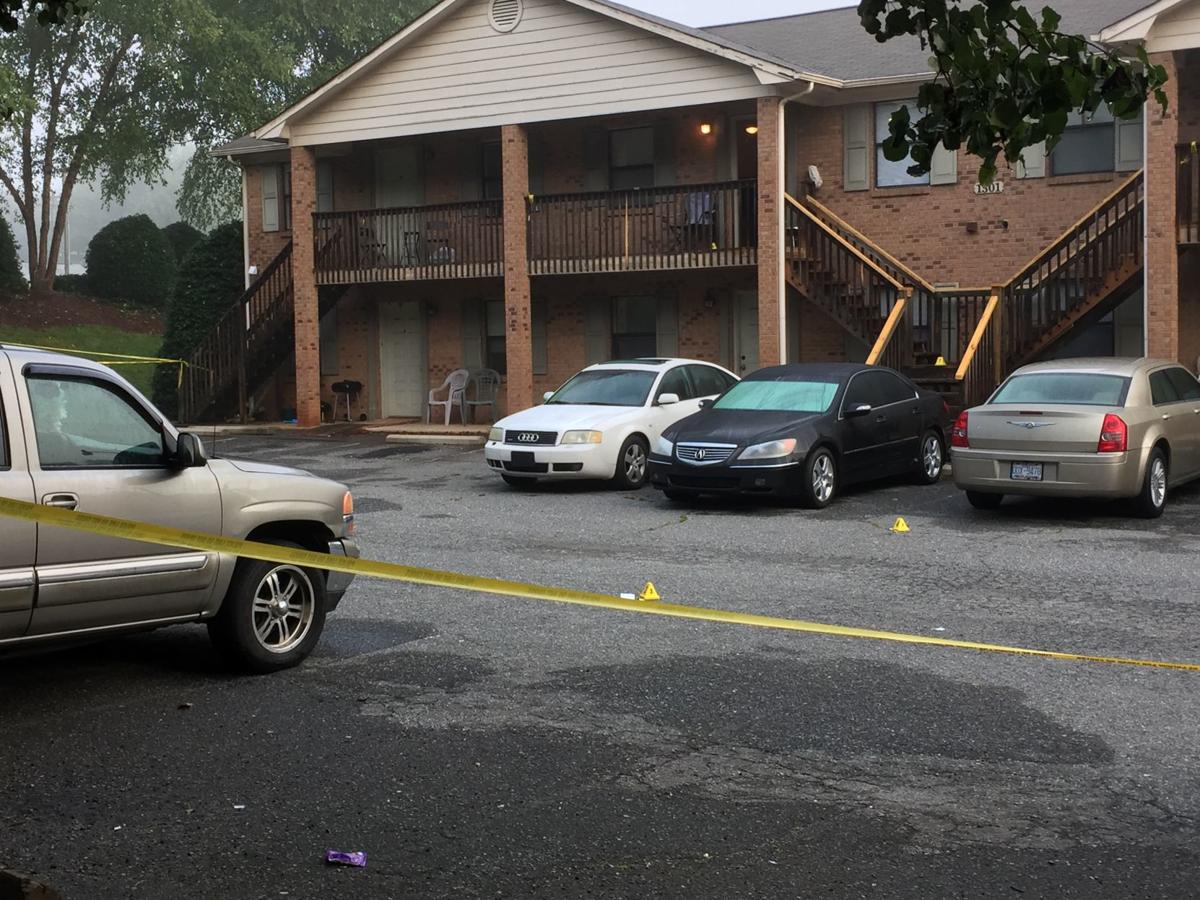 Basketball coach shot after answering his apartment door