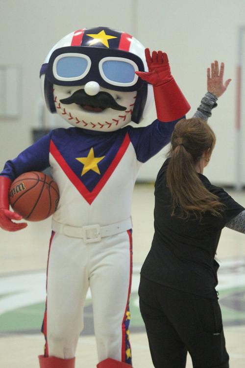 Kannapolis Middle School nurse Barbara Jackson and Cannon Ballers Mascot "Boomer"