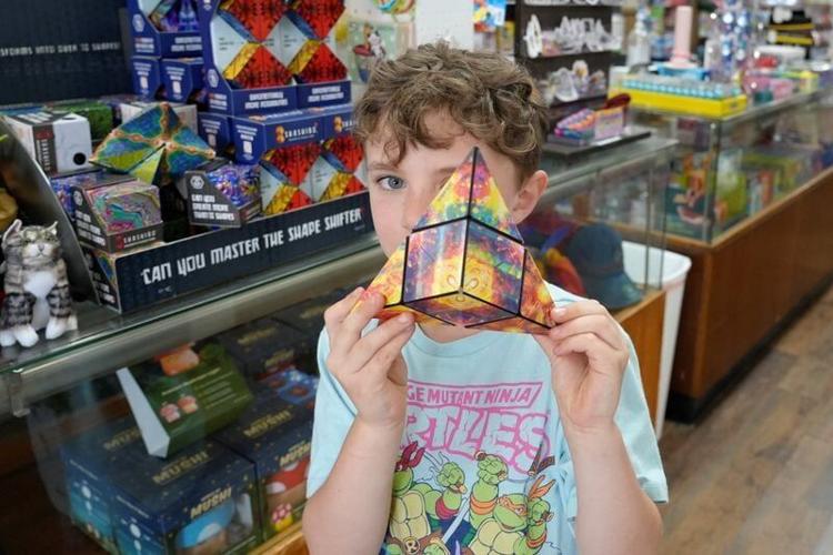 River Gatz, 7, a customer at the new downtown Hendersonville location of O.P. Taylor's Toys, March 31, 2026.