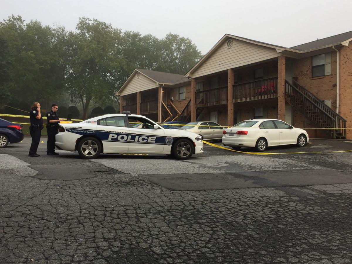 Basketball coach shot after answering his apartment door