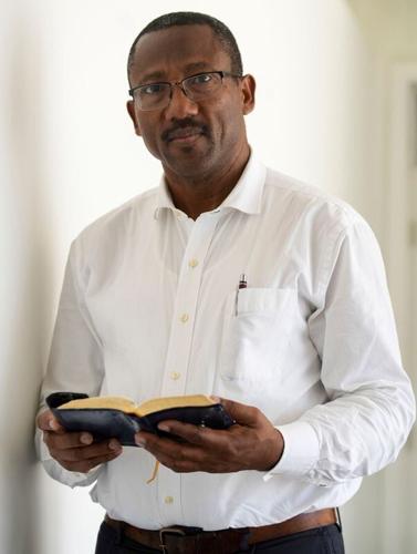Seventh Day Adventist pastor Michelet William stands for a photo Monday, July 13, 2026, at the church he leads on the west side of Indianapolis. William’s congregation includes Haitian worshippers, many of whom are Temporary Protected Status holders.