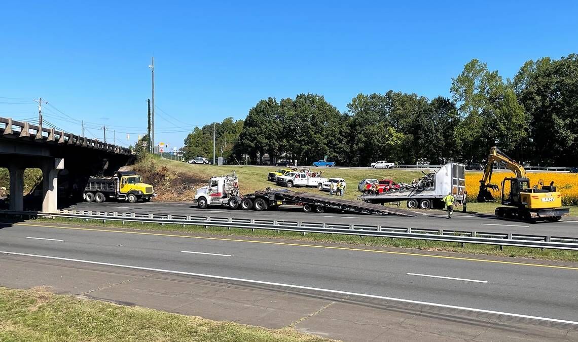 N.C. Highway Patrol, Orange County Sheriffs Office and Hillsborough Police were helping to direct traffic Wednesday morning, Aug. 14, 2022, at Interstate 85 and NC 86 in Hillsborough as the remains of a tractor-trailer were being loaded onto a truck fo...