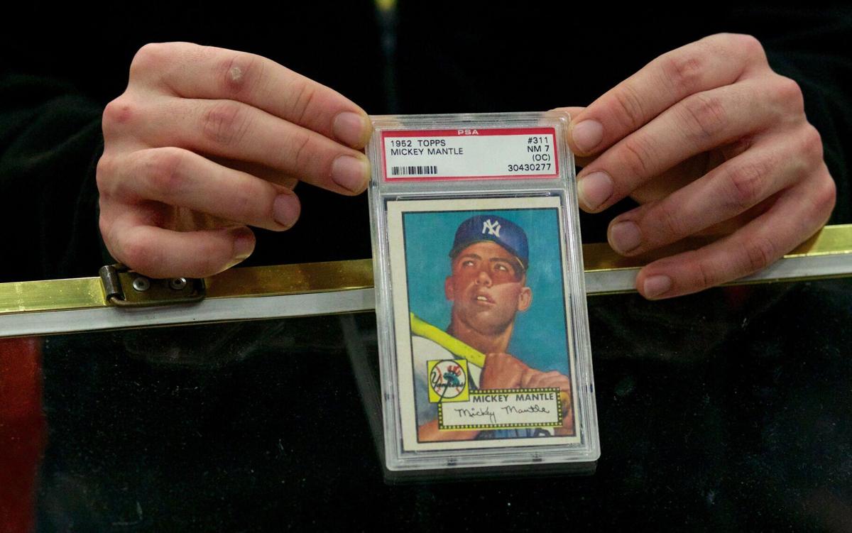 The Topps 1952 Mickey Mantle Card #311, sometimes called the'' holy grail'' of post-war baseball card collecting, is displayed here by Huggins& Scott Auctions at the White Plains County Center Baseball Card Show in New York on Jan. 19, 2013.