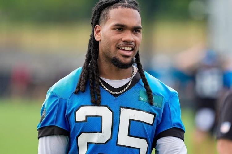 Jun 9, 2026; Charlotte, NC, USA; Carolina Panthers running back Jonathan Brooks (25) walks off the field during the first day of mini camp at Bank of America Stadium practice facility. Mandatory Credit: Jim Dedmon-Imagn Images