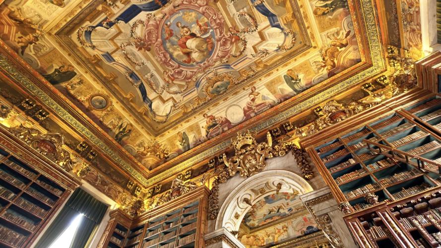 The painted ceiling of King João’ s Library at Portugal’ s University of Coimbra is an example of the Baroque illusion technique called trompe l’ oeil.
