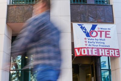 People pass by the early voting location at the Leon County Courthouse as polls open for the first day of early voting on Monday, Oct. 19, 2026.