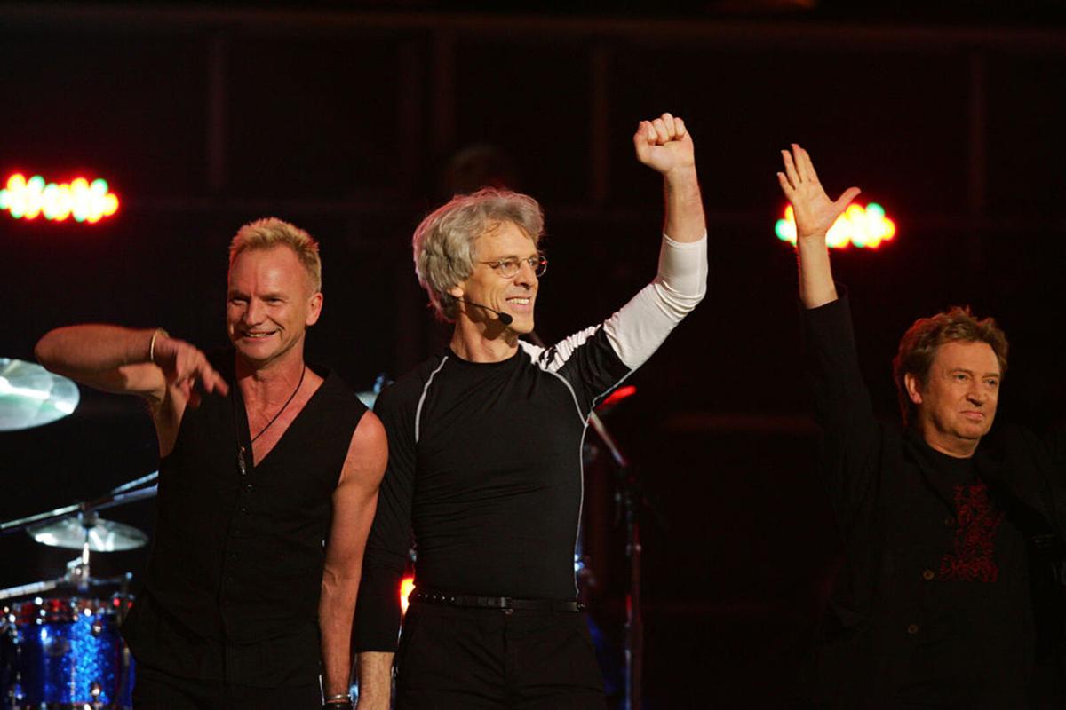 Five-time Grammy winners The Police, reuniting singer Sting, drummer Stewart Copeland and guitarist Andy Summers wave after performing at the 49th Grammy Awards in Los Angeles on February 11, 2007.