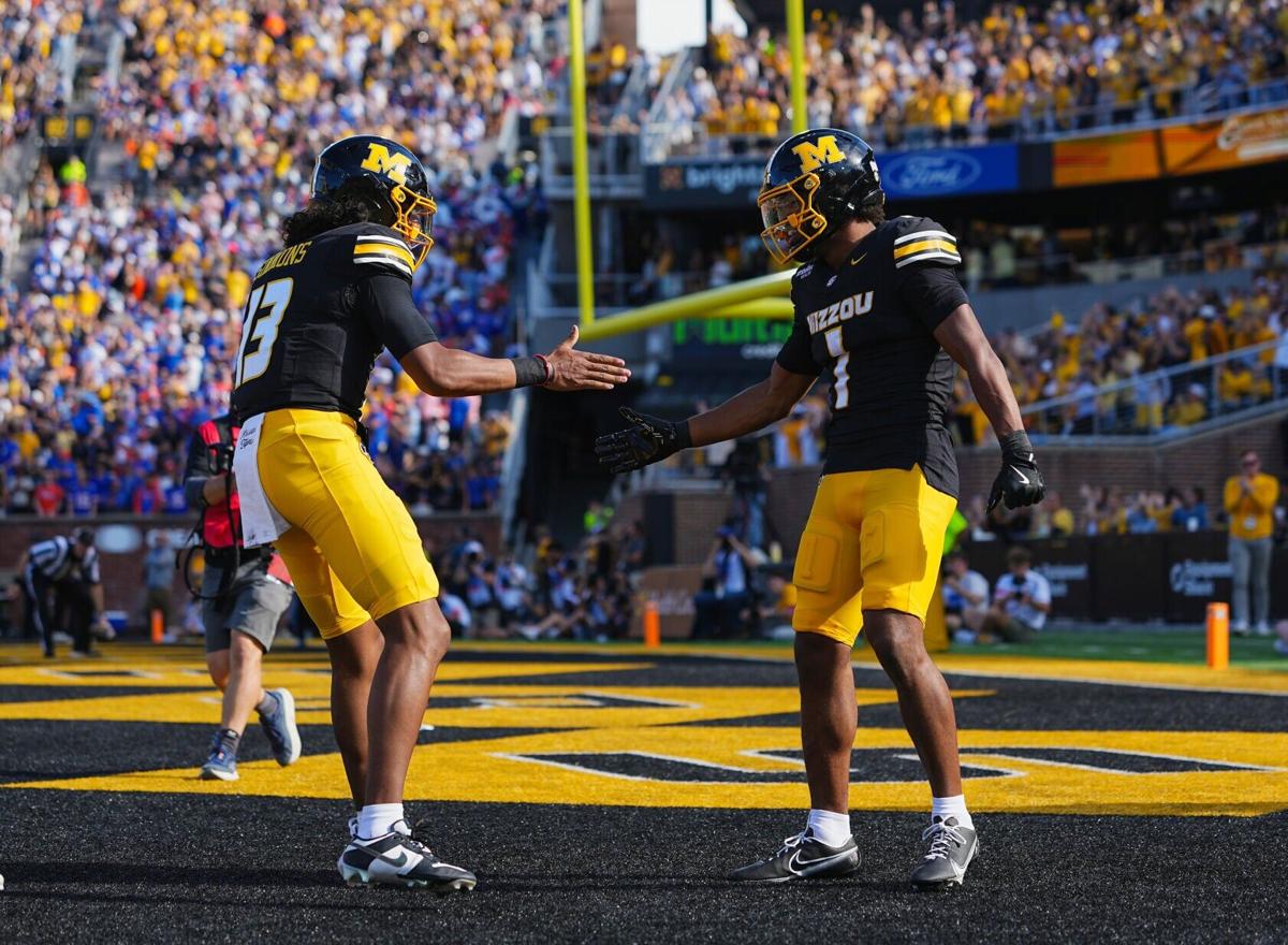 Missouri's Austin Simmons and Donovan Olugbode celebrate after a first-half touchdown against Florida at Faurot Field at Memorial Stadium on Saturday, Oct. 3, 2026, in Columbia, Missouri.