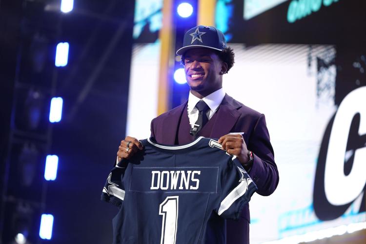 Caleb Downs of Ohio State celebrates after being selected with the 11th overall pick by the Dallas Cowboys during the first round of the 2026 NFL Draft at Acrisure Stadium on Thursday, April 23, 2026, in Pittsburgh.