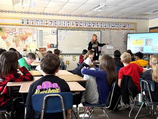 James Cole Elementary fourth grade teacher Ashlyn Thayer goes over the "Boiler board" with students on Dec. 17, 2025, using Purdue basketball's game against Marquette as a teaching mechanism.