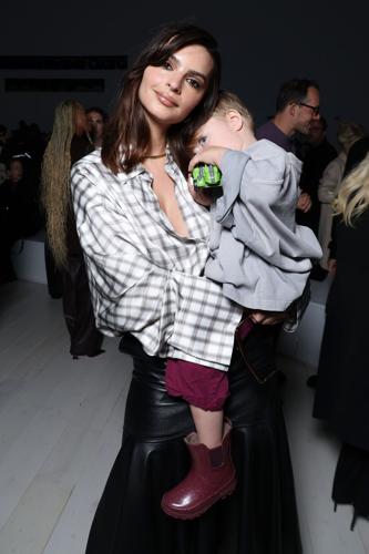 Emily Ratajkowski and her son Sylvester Apollo Bear attend the Loewe Paris Womenswear Spring-Summer 2025 show as part of Paris Fashion Week on Sept. 27, 2024, in Paris.