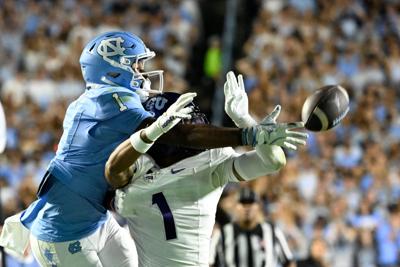 Sep 1, 2025; Chapel Hill, North Carolina, USA; TCU Horned Frogs safety Austin Jordan (1) breaks up a pass intended for North Carolina Tar Heels wide receiver Jordan Shipp (1) in the second quarter at Kenan Stadium. Mandatory Credit: Bob Donnan-Imagn Images