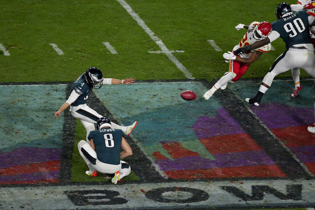 Philadelphia Eagles tight end Dallas Goedert (88) is tackled by Kansas City  Chiefs cornerback Jaylen Watson (35) and linebacker Nick Bolton (32) during  the first half of the NFL Super Bowl 57