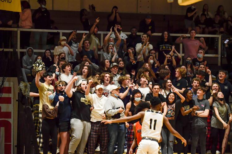 The Trojans defeated the Spiders 51-50 in overtime .