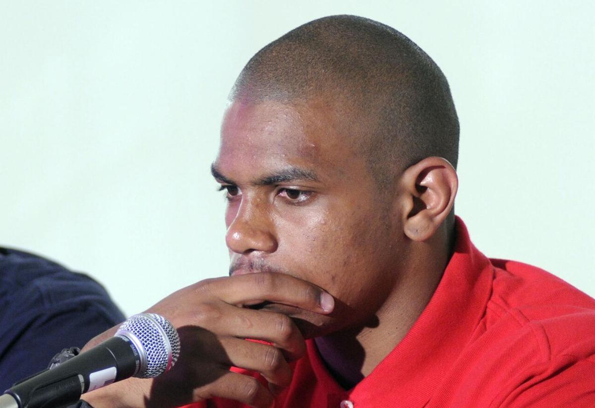 Speaking for the first time since his Ohio State career ended in scandal, Terrelle Pryor appears with agent Drew Rosenhaus and apologizes to the Buckeyes, his former teammates and now-departed coach Jim Tressel, during a news conference in Miami on June 14, 2011.