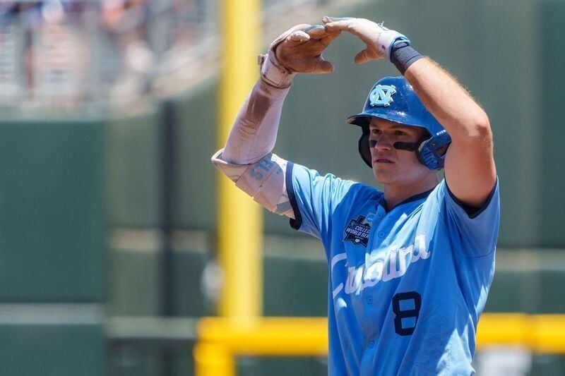 Jun 17, 2026; Omaha, NE, USA; North Carolina Tar Heels center fielder Owen Hull (8) celebrates after driving in a run on a double against the West Virginia Mountaineers during the fourth inning at Charles Schwab Field. Mandatory Credit: Dylan Widger-Ima...