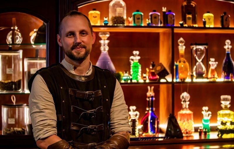 Lewis Cantwell, owner of Moon & Root Apothecary, poses for a portrait inside the business along College Street in downtown Asheville on May 13, 2026.