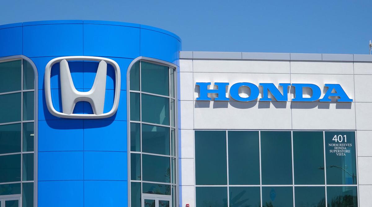 The Honda name and logo are seen on a dealership in Vista, California on April 29, 2021.