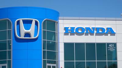 The Honda name and logo are seen on a dealership in Vista, California on April 29, 2021.