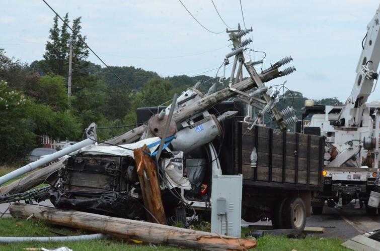 A truck hit a power pole after a collison on US Highway 70 in Statesville on Wednesday.