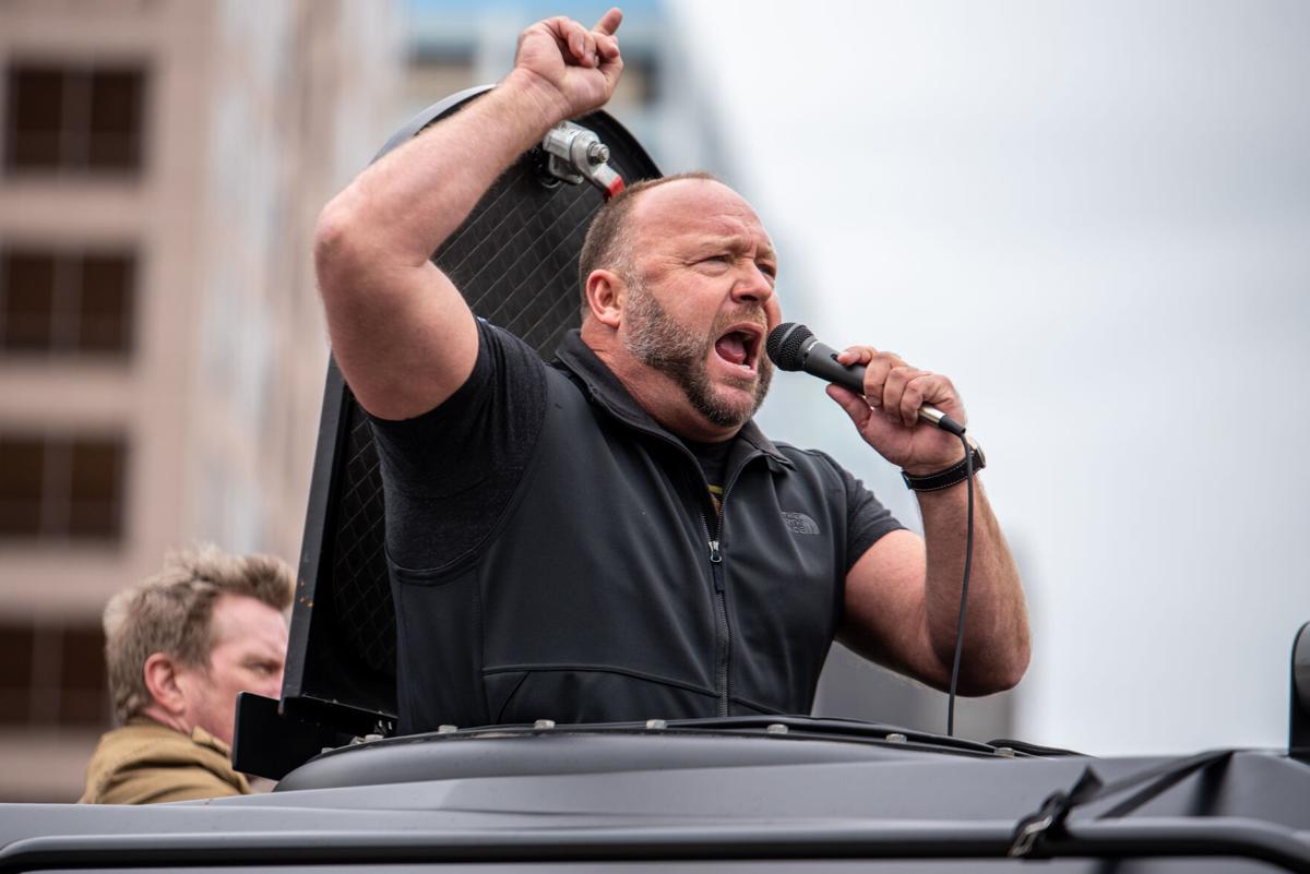In this file photo, Infowars host Alex Jones arrives at the Texas State Capitol building on April 18, 2020, in Austin, Texas.