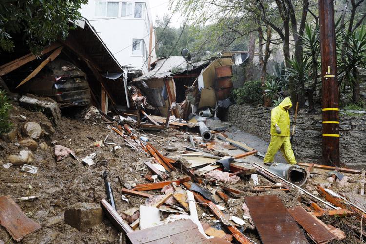 Mud and debris block portions of the 10000 block of Caribou Lane, where a mudslide destroyed a home, on Monday, Feb. 5, 2024, in the Beverly Crest area of Los Angeles.