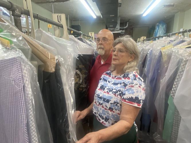 Martin and Zelda examining clothes