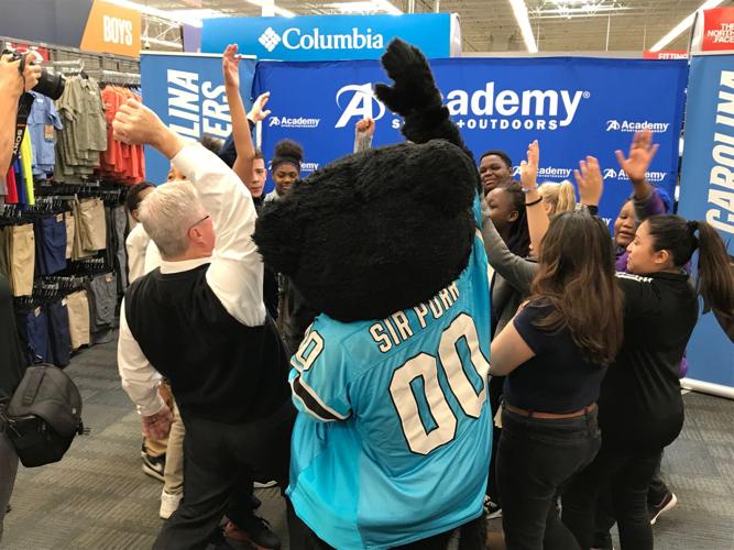 Students cheer reading at Carolina Panthers rally