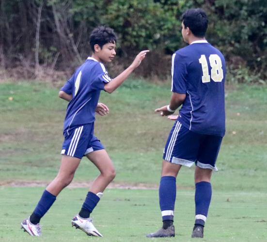 Concord Academy vs Hickory Grove Cuicui Gonzalez (9) is congratulated on his goal by Richy Medina (18). Joan Moore/Special to the Independent Tribune