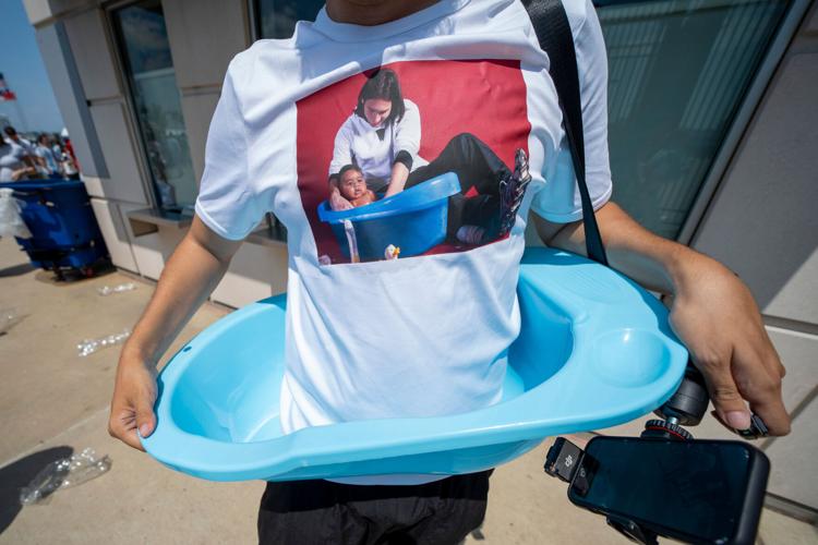 A fan wears an outfit featuring the viral photo of Lionel Messi and baby Lamine Yamal before the FIFA World Cup 2026 final