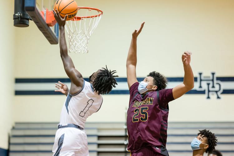 Boys Basketball: The Boys Jay M. Robinson Bulldogs defeated the Hickory Ridge RaginÕ Bulls 72-69 on Thursday night.