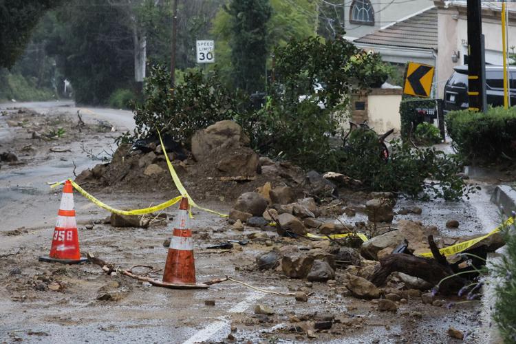 Mud and debris block portions of Beverly Glen Boulevard, Monday, Feb. 5, 2024, in the Beverly Crest area of Los Angeles.